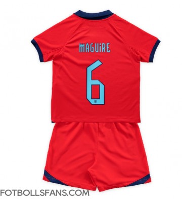 England Harry Maguire #6 Replika Bortatröja Barn VM 2022 Kortärmad (+ Korta byxor)